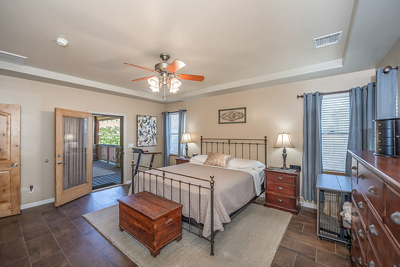master bedroom door leading to front porch