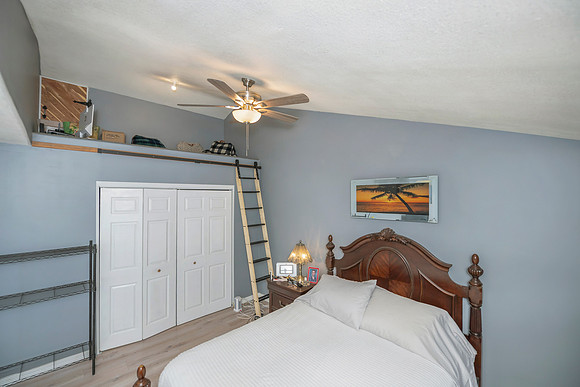 a (42) second master room showing lofted area