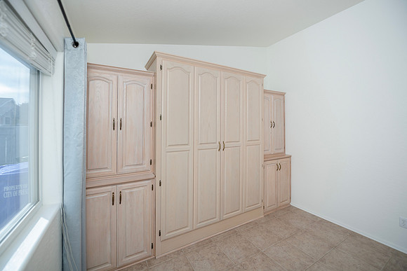 guest room, office room off front living room with french doors trundle bed