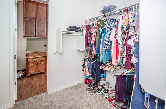 walk through master closet showing laundry room